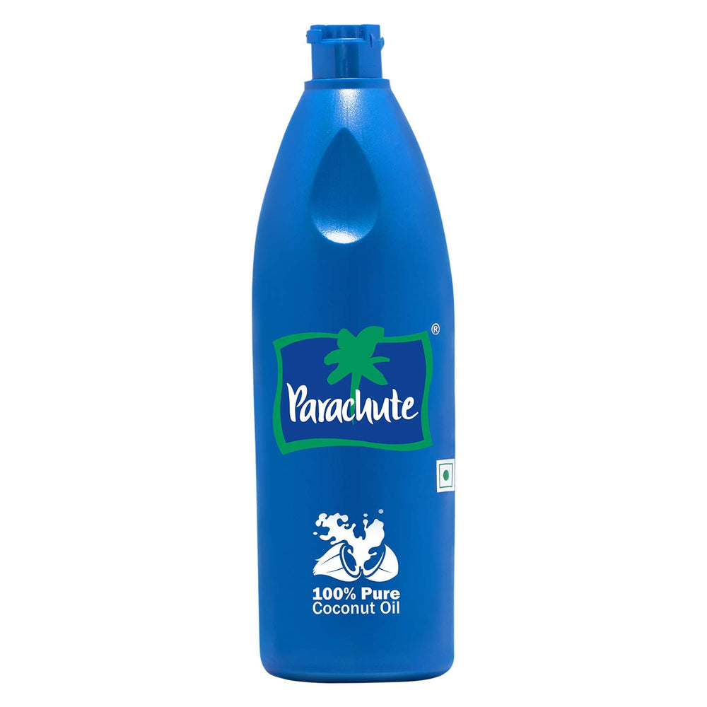Parachute coconut oil bottle pour shows pure, unrefined oil ideal for skin care