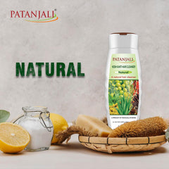 Patanjali Kesh Kanti bottle close-up showing herbal branding