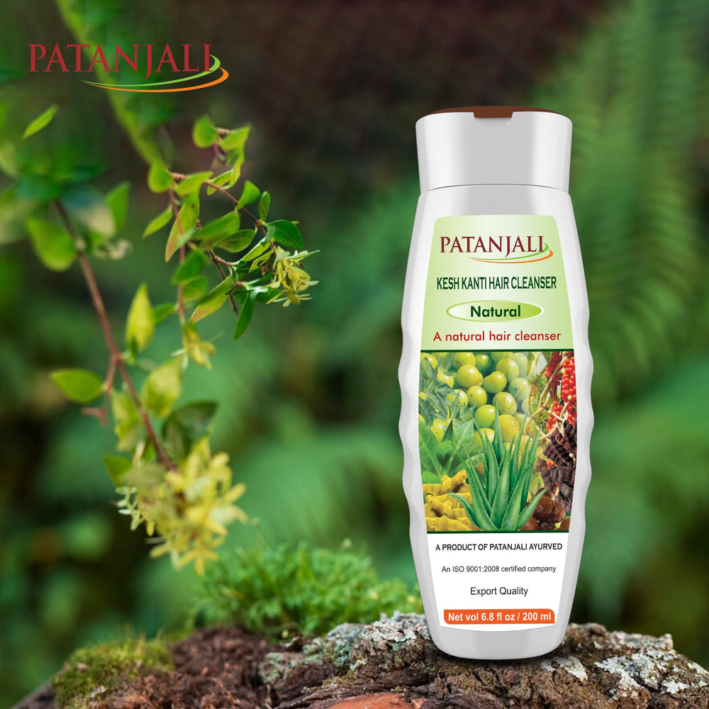 Patanjali Kesh Kanti applying onto hair during routine