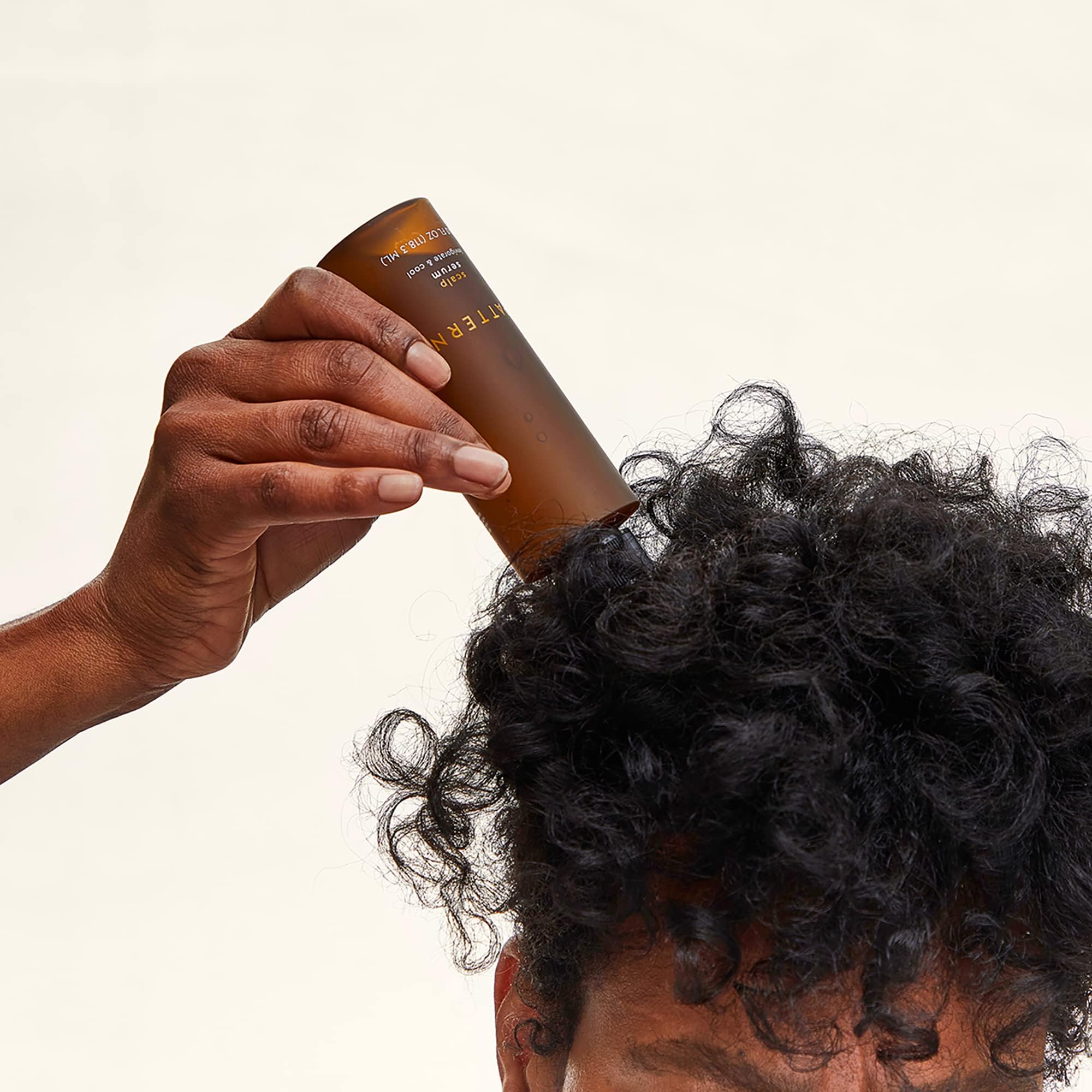 PATTERN Beauty serum-application demonstrates easy rub-in for root relief.