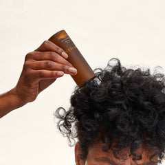 PATTERN Beauty serum-application demonstrates easy rub-in for root relief.