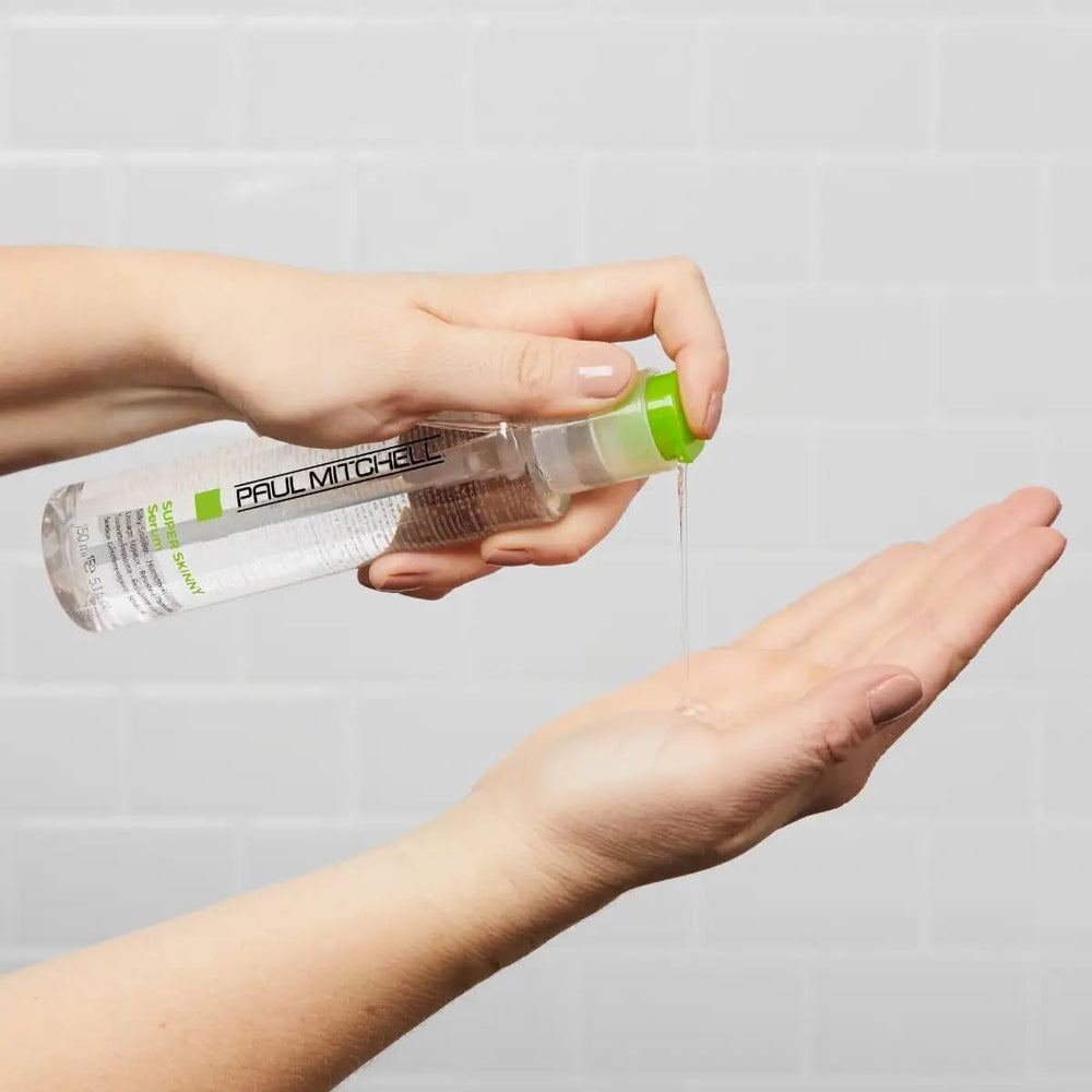 Paul Mitchell Serum close-up shows silicone coating sealing strands.