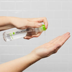 Paul Mitchell Serum close-up shows silicone coating sealing strands.