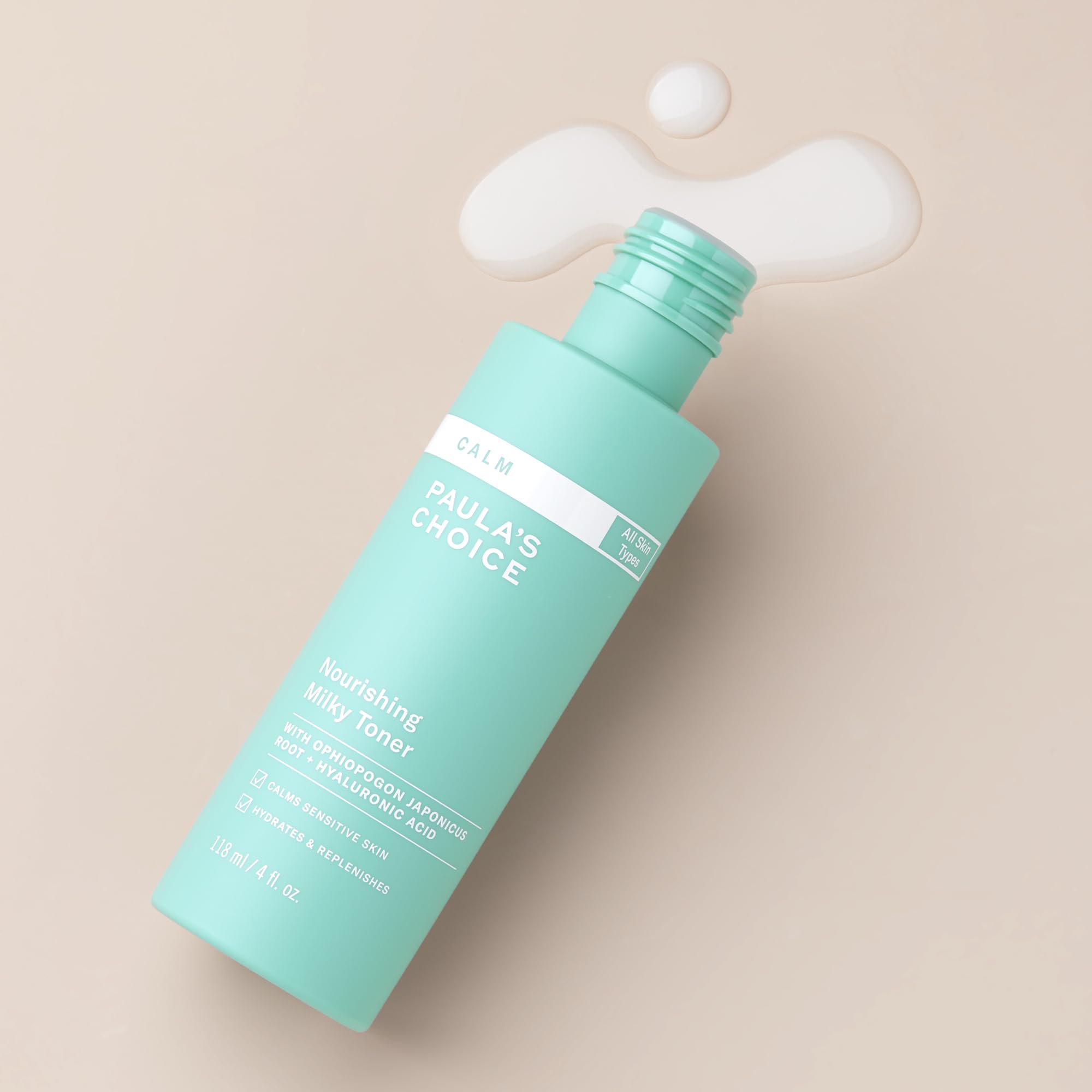 Texture of Paula's Choice Calm Nourishing Milky Toner shown on skin for soothing hydration.