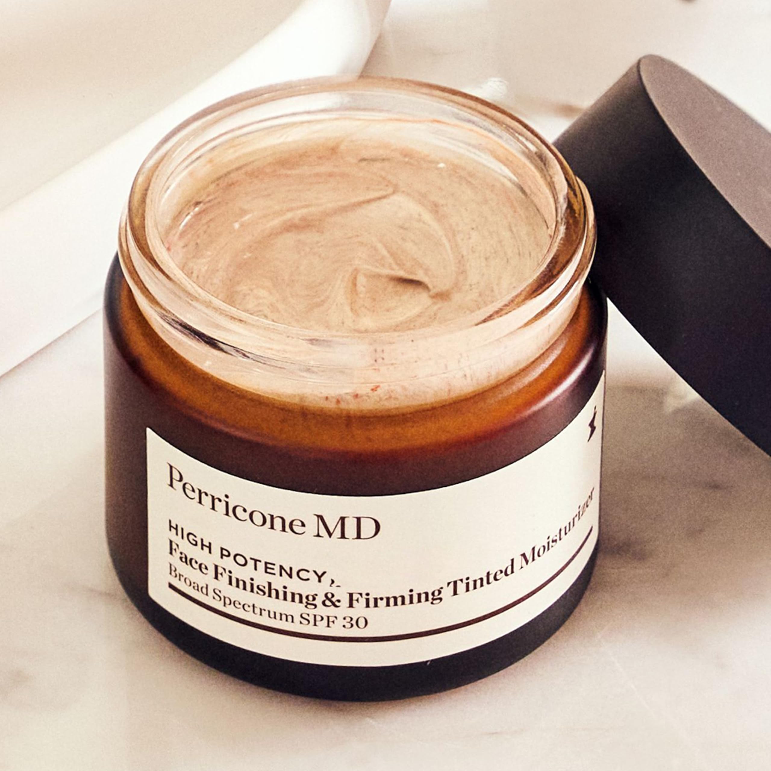 Perricone MD close-up of cheek reveals soft glow and smooth texture.