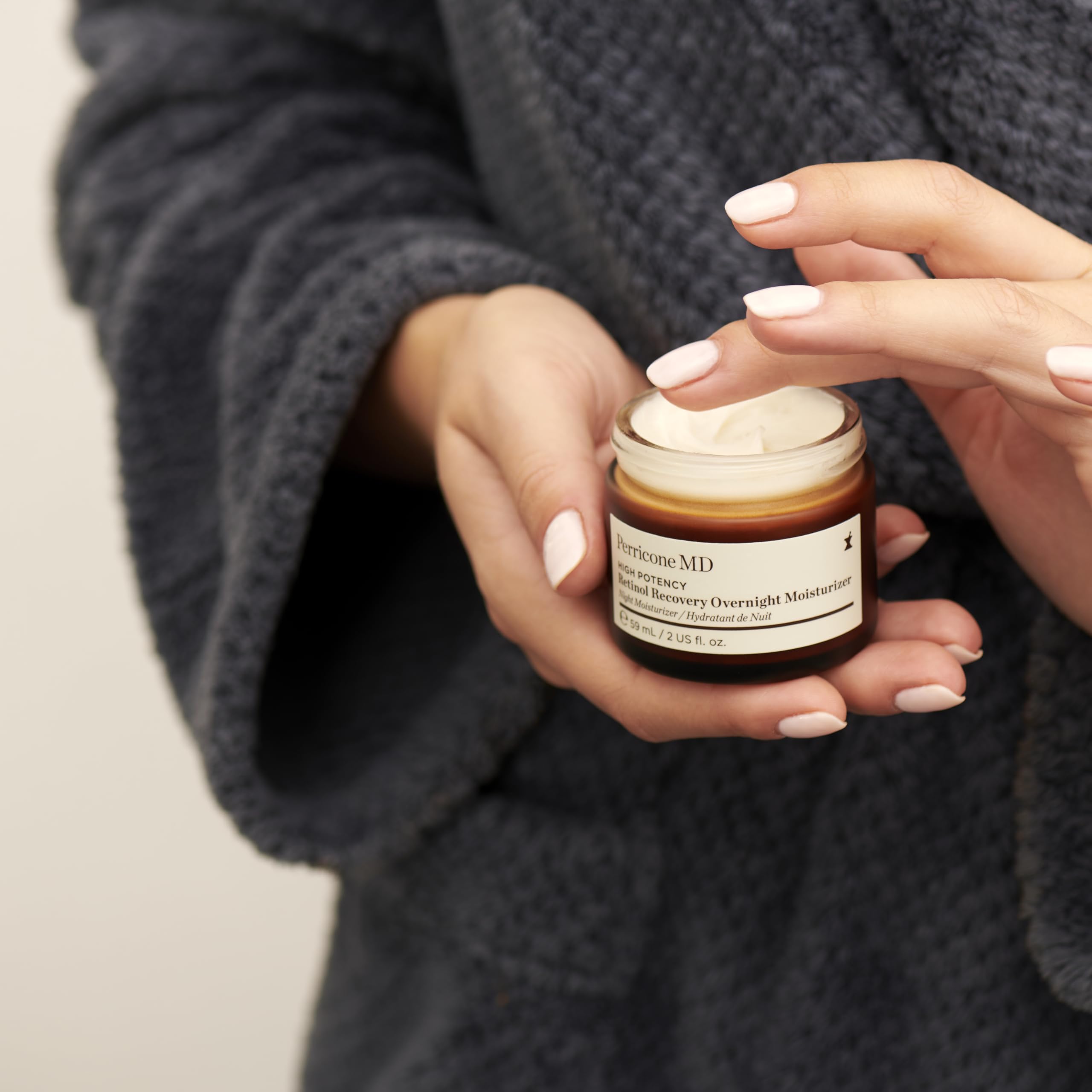 Perricone MD fluid texture shown on skin swatch emphasizes cream consistency