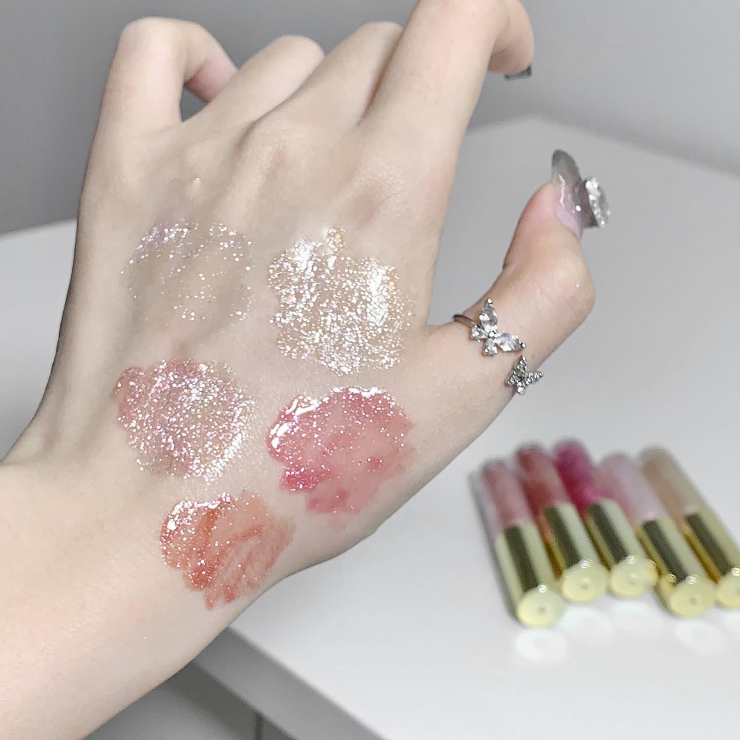 Petansy lip plumper gloss hints fuller lips with a glossy sparkle.