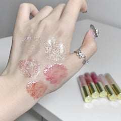 Petansy lip plumper gloss hints fuller lips with a glossy sparkle.
