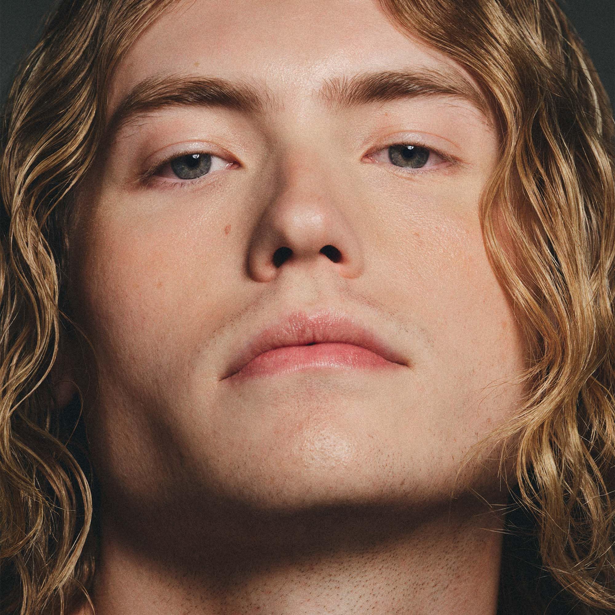 Peter Dundas tinted moisturizer upcycled blueberry seed oil offers antioxidant protection.