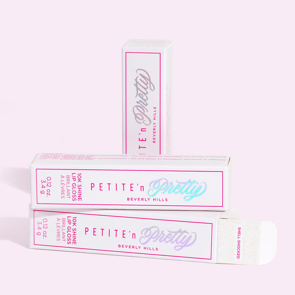 Petite N Pretty 10K Shine Lip Gloss Shell Shocked pearls add light-reflecting shine.