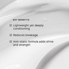 PHILIP KINGSLEY Moisture Balancing Conditioner texture close-up shows creamy hydration.