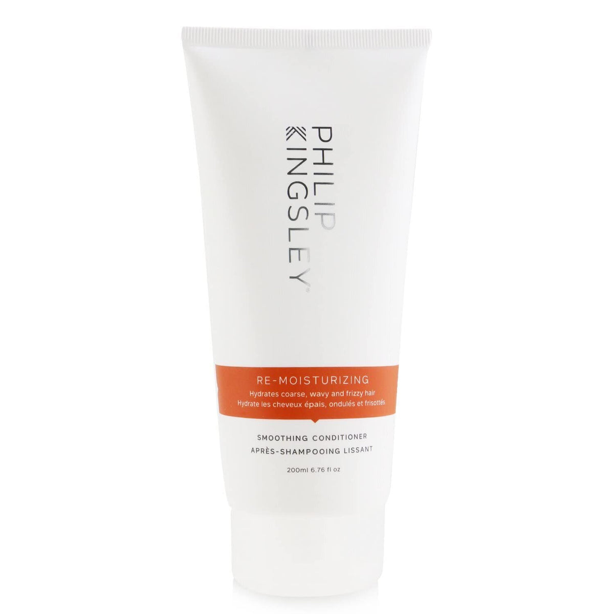 Philip Kingsley Re-Moisturizing Conditioner bottle pour promotes lightweight hydration.