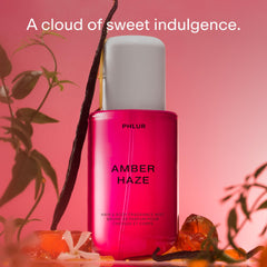 PHLUR Amber Haze bottle side view, sleek design for on-the-go use.