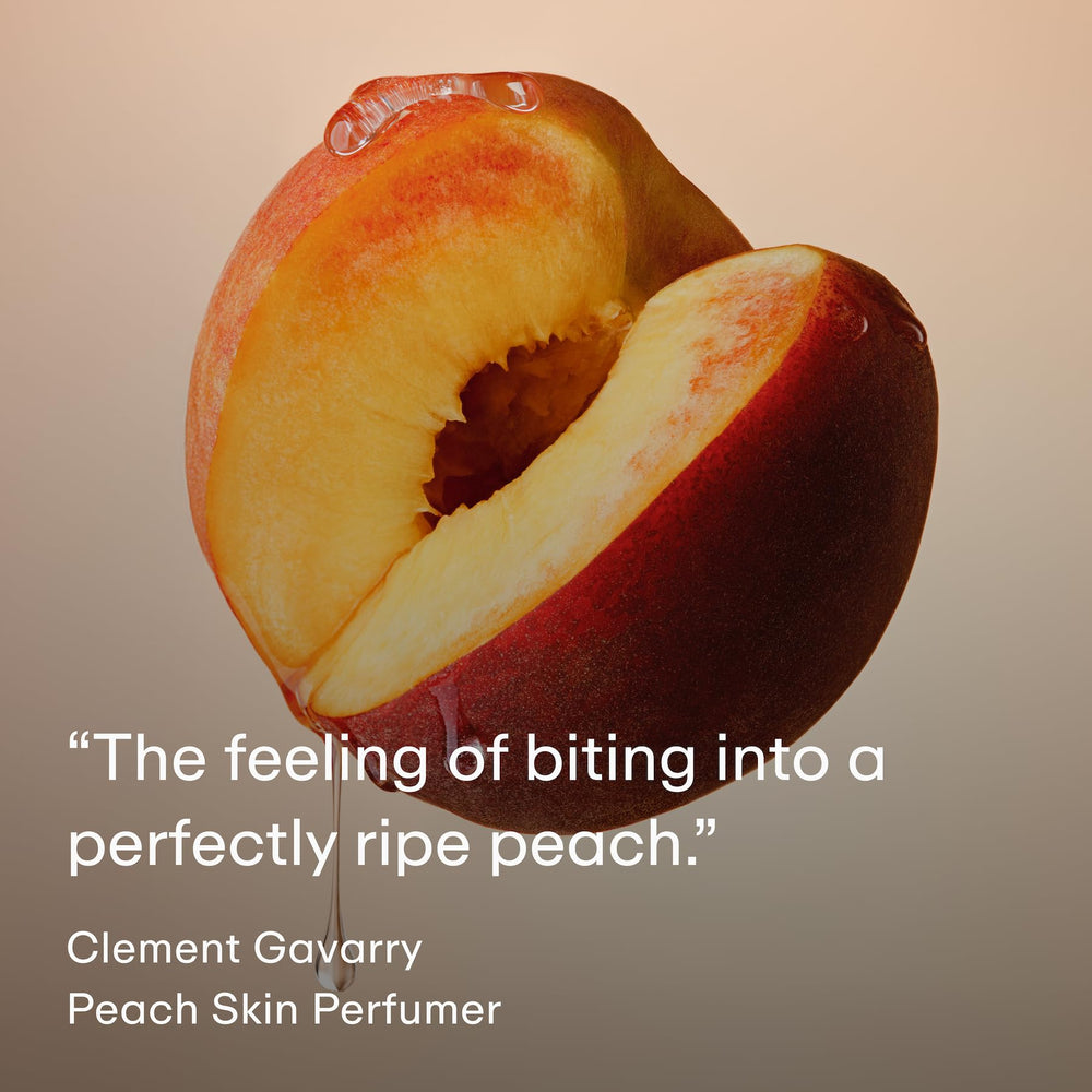 PHLUR Peach Skin bottle in hand ideal for layering with other scents.