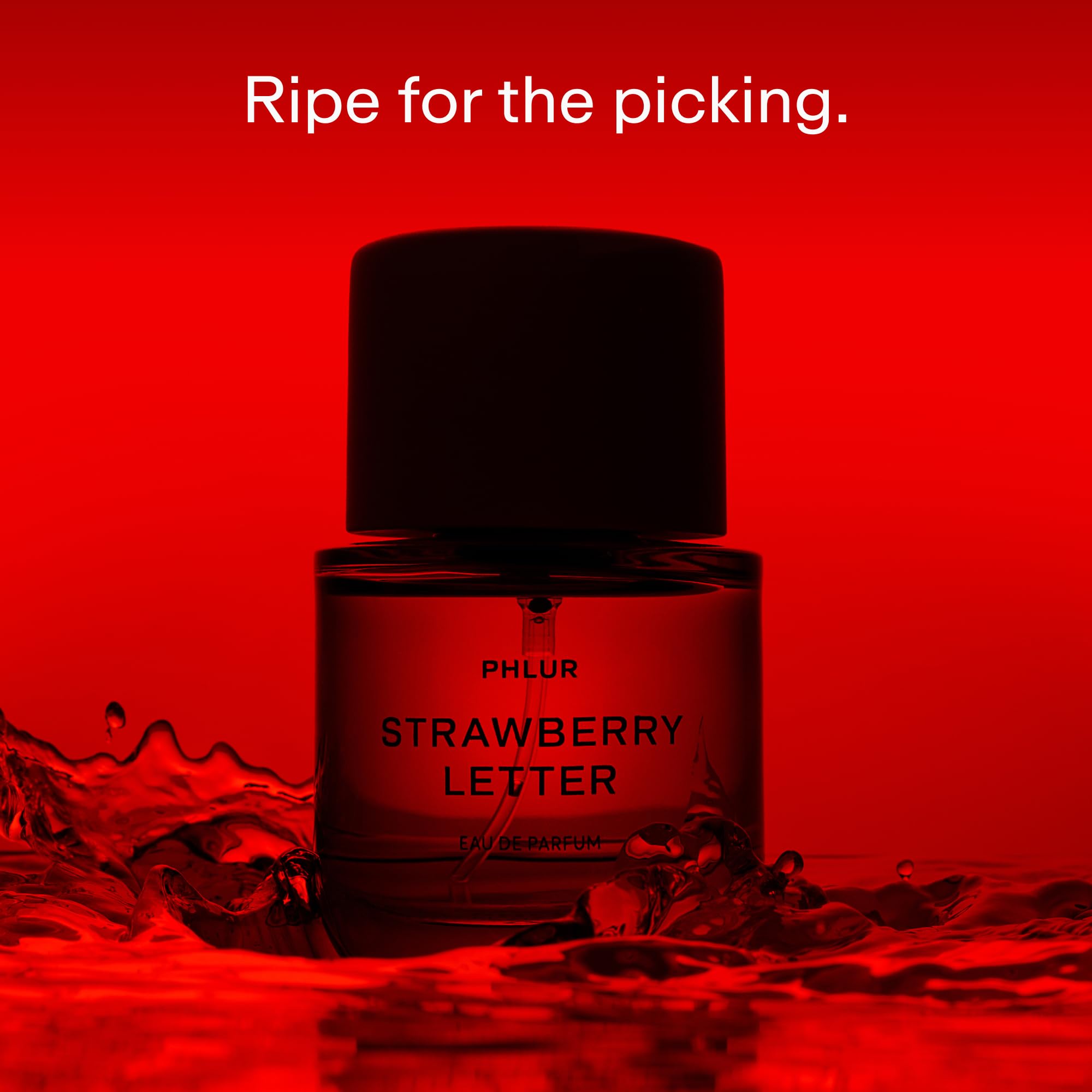 PHLUR Strawberry Letter cap closeup showing the magnetic lid for a premium feel
