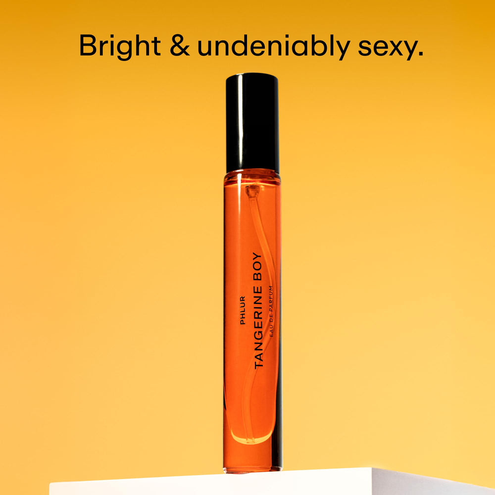 PHLUR Tangerine Boy travel size case ready for on the go fragrance refresh.