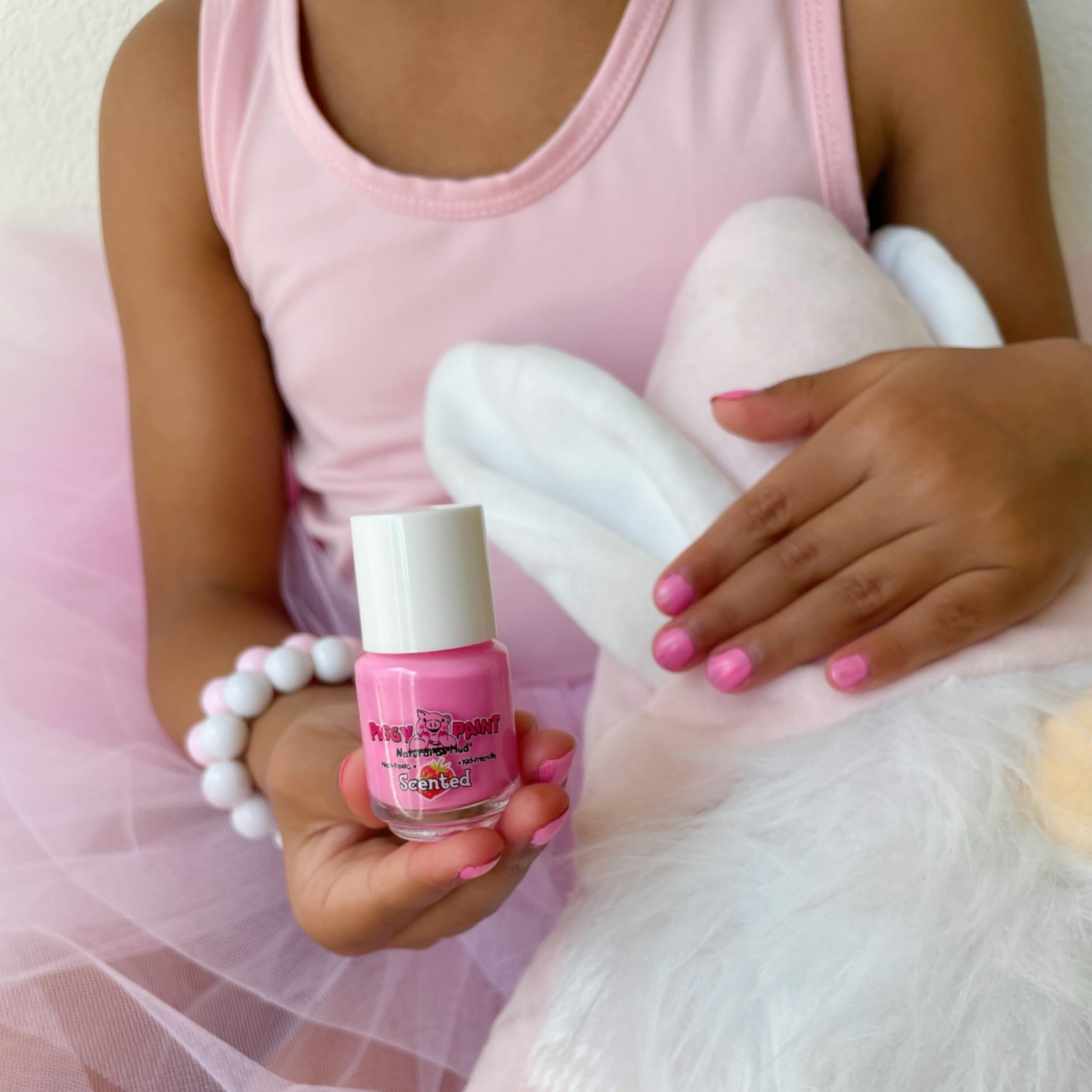 Piggy Paint swatches on nails show opaque, bright colors.