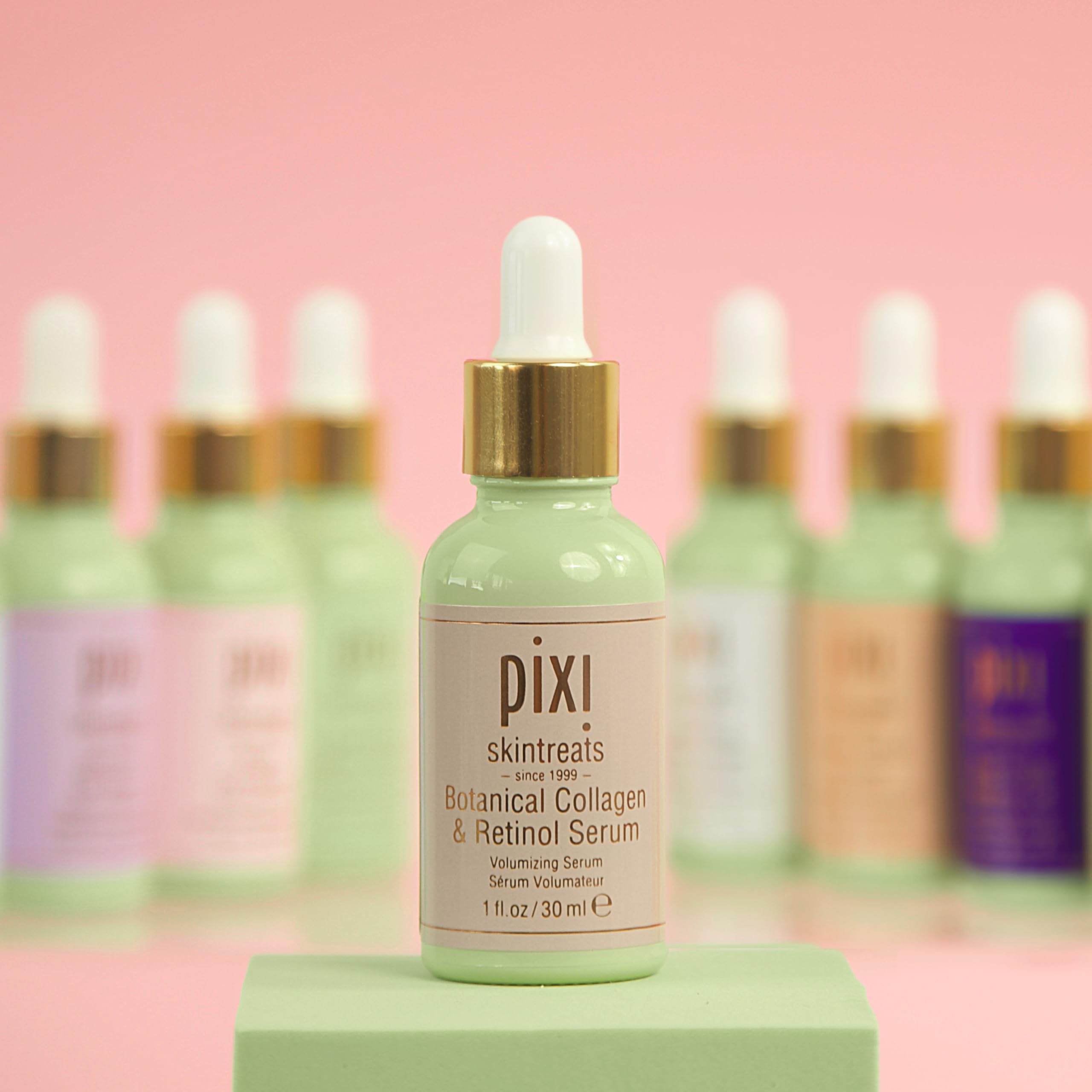 Pixi Beauty serum vial in hand, ready for nightly skincare.