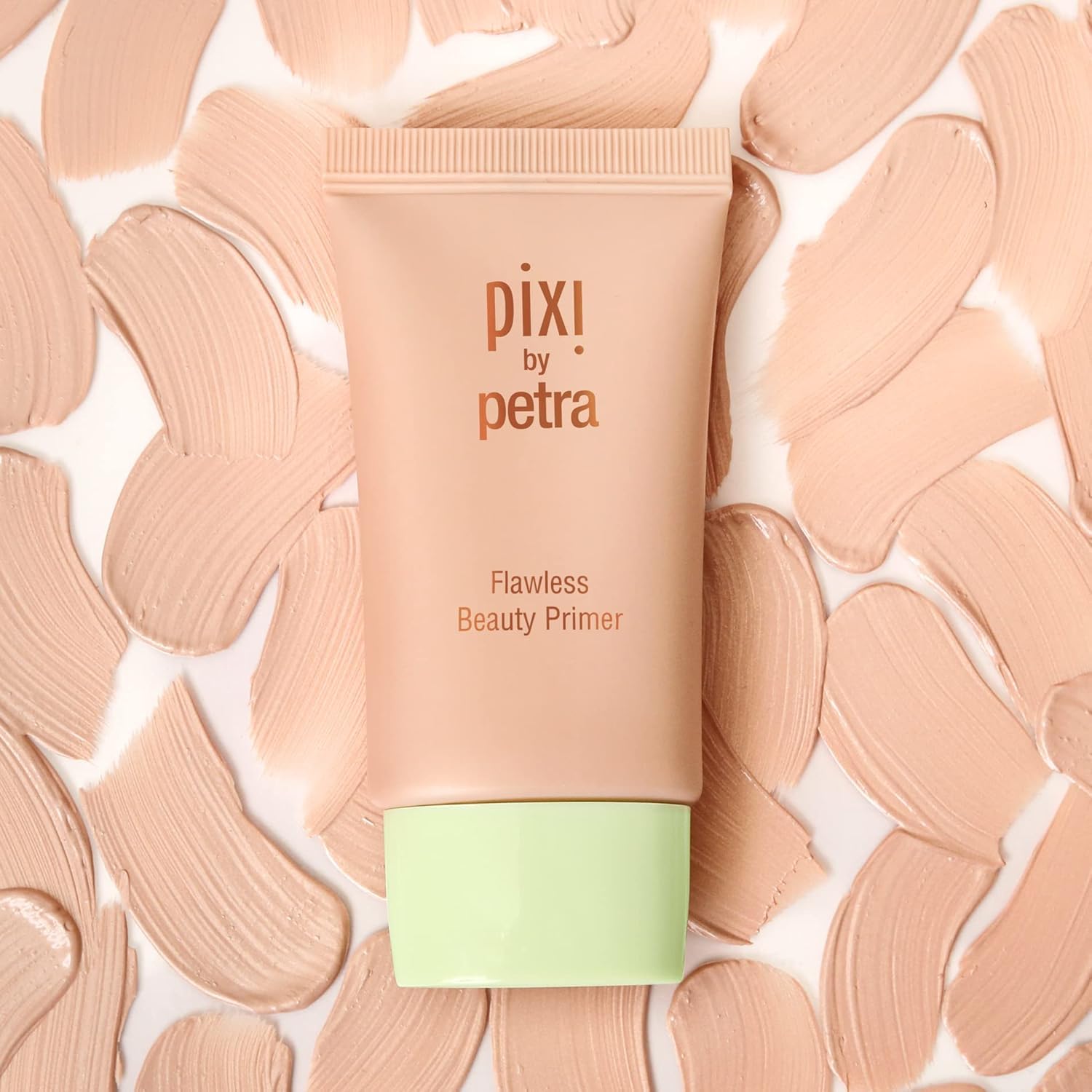 Pixi Flawless Beauty Primer application creates a smooth base for even-toned skin.