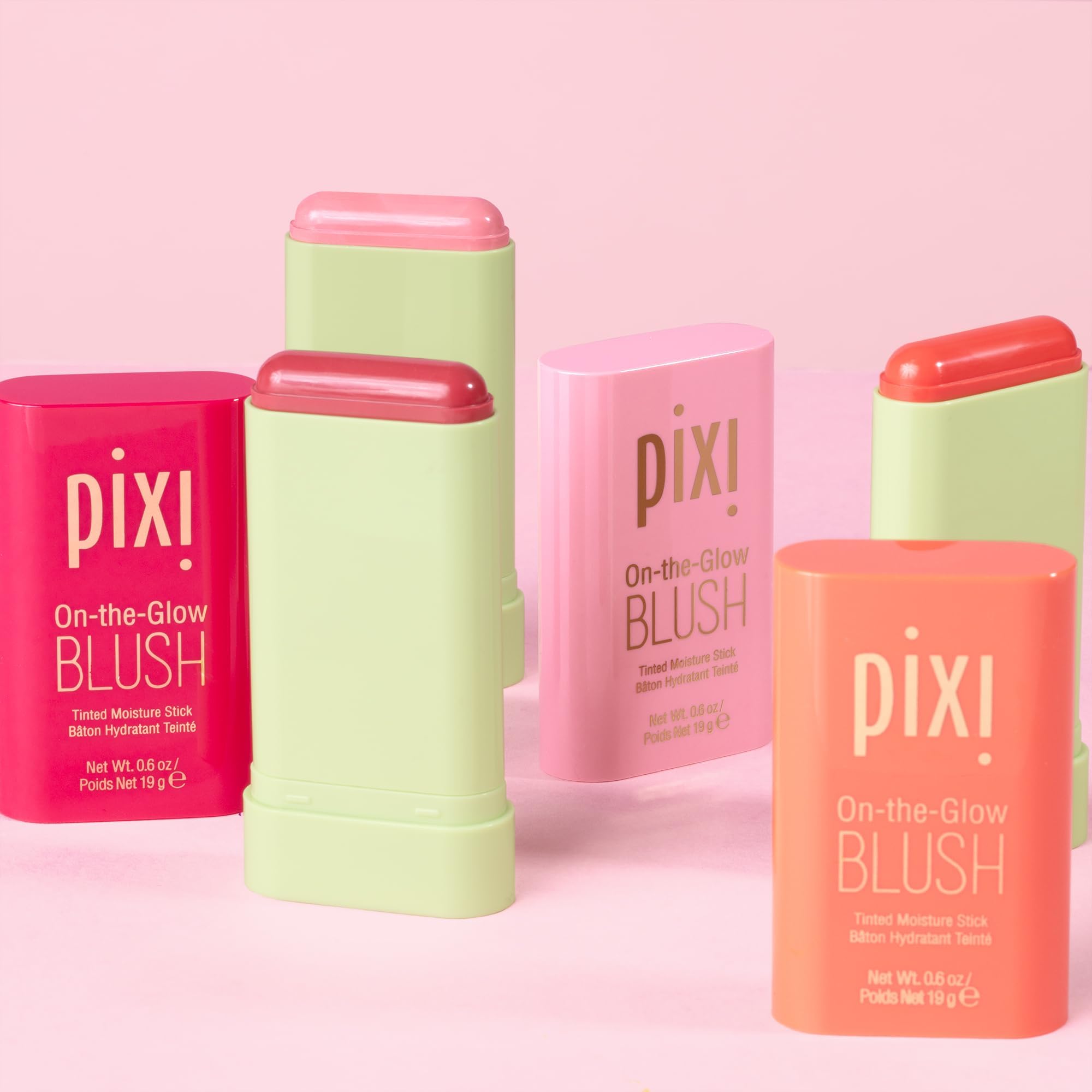 Applying Pixi On-the-Glow Blush for smooth glide on the skin.