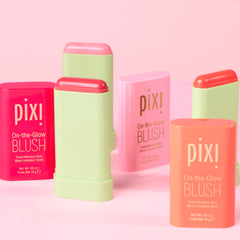 Applying Pixi On-the-Glow Blush for smooth glide on the skin.