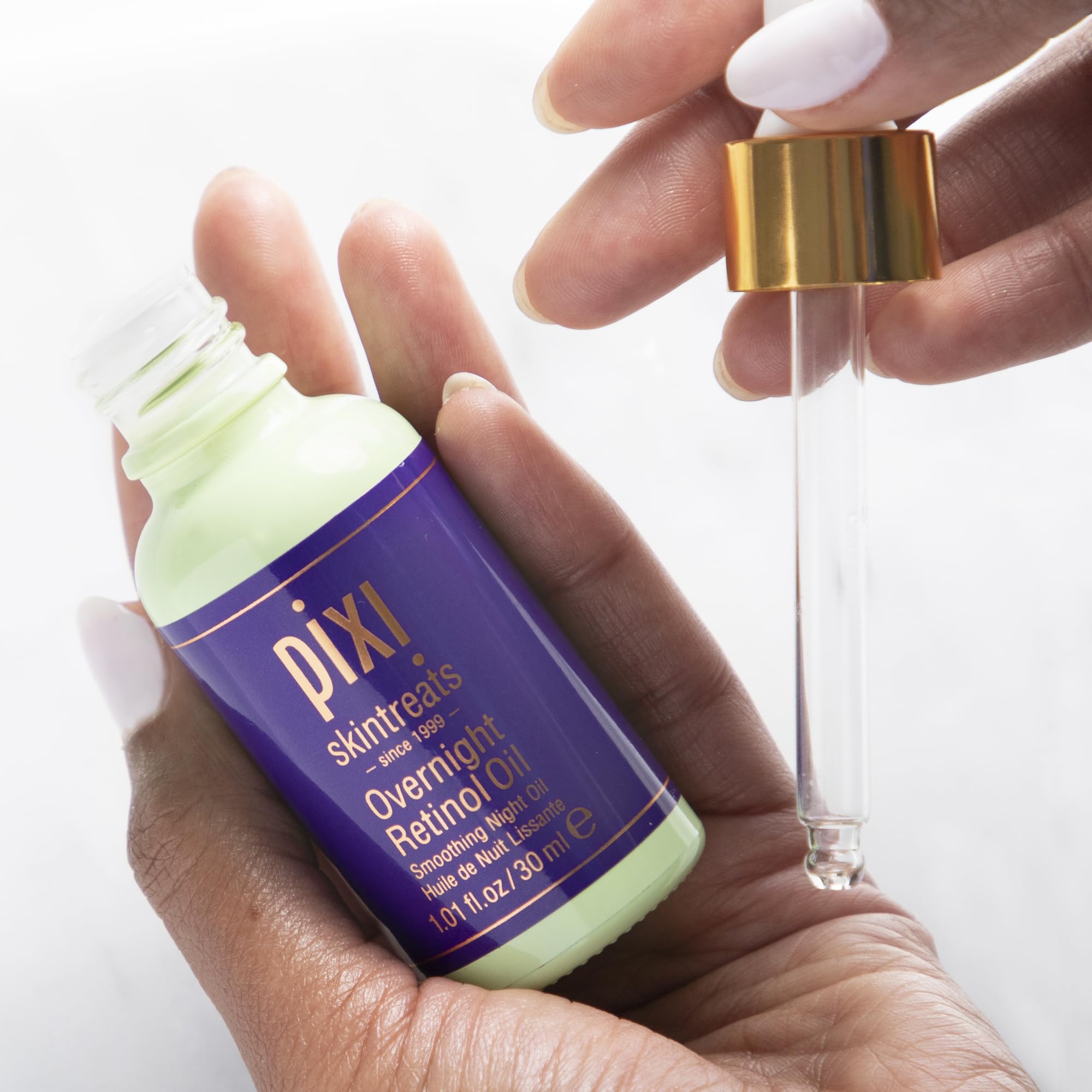 Pixi Beauty Overnight Retinol Oil bottle-back-closeup reinforces nightly ritual trust.