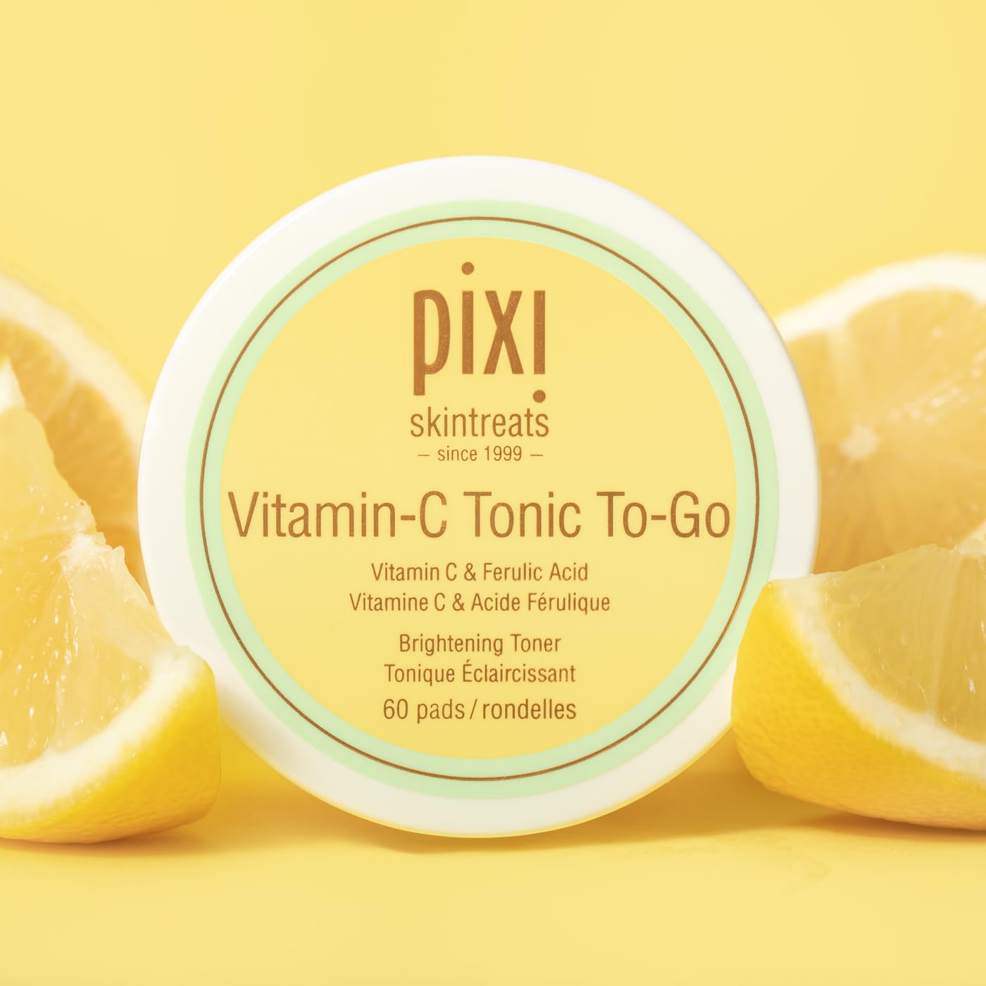 Pixi Vitamin-C Tonic to-Go pads in hand for on-the-go routine