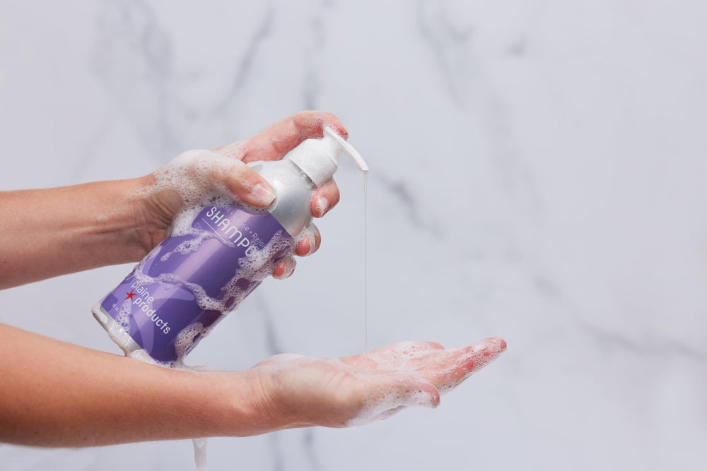 Plaine Products Citrus Lavender conditioner bottle, hydrating formula for shine.