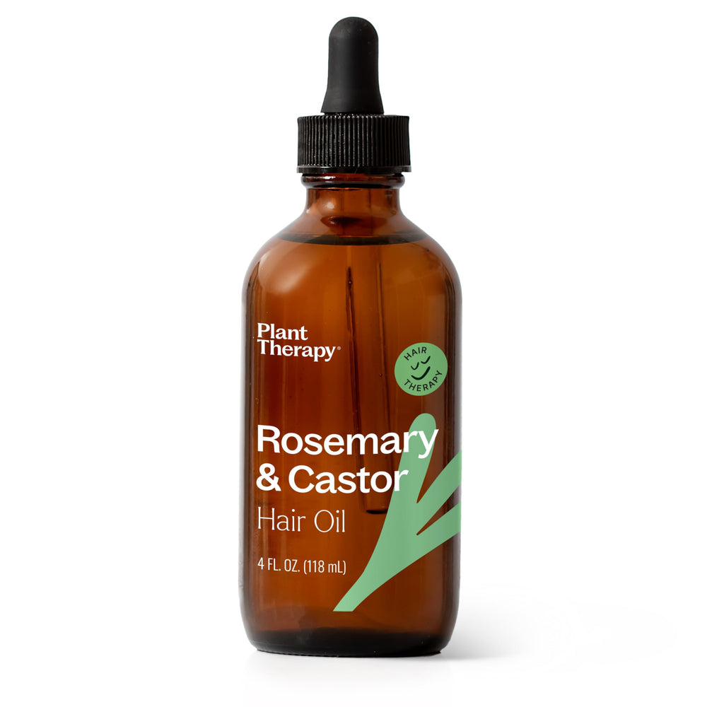Plant Therapy Rosemary & Castor Oil bottle being poured for scalp nourishment.