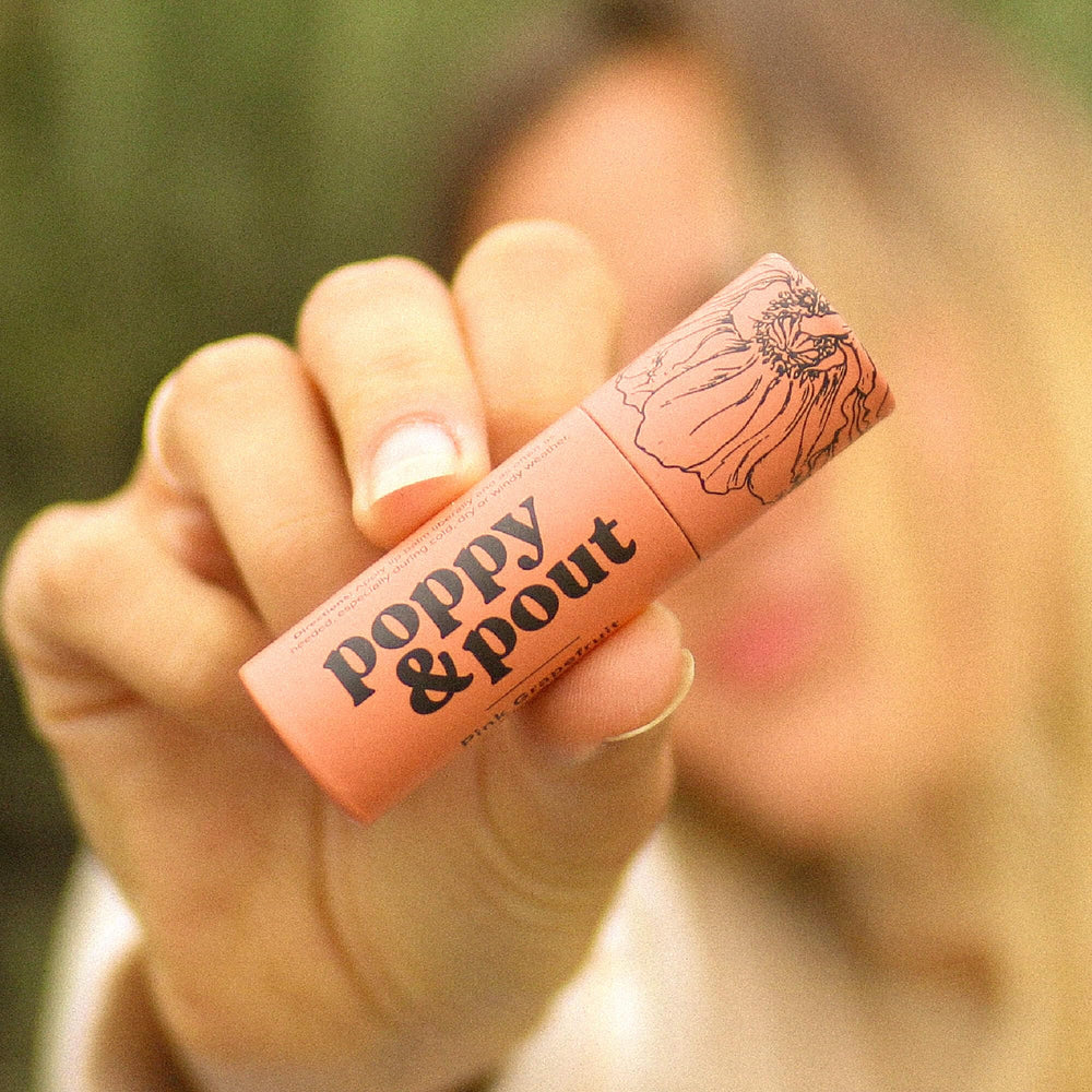Poppy & Pout recyclable cardboard tube packaging on display.