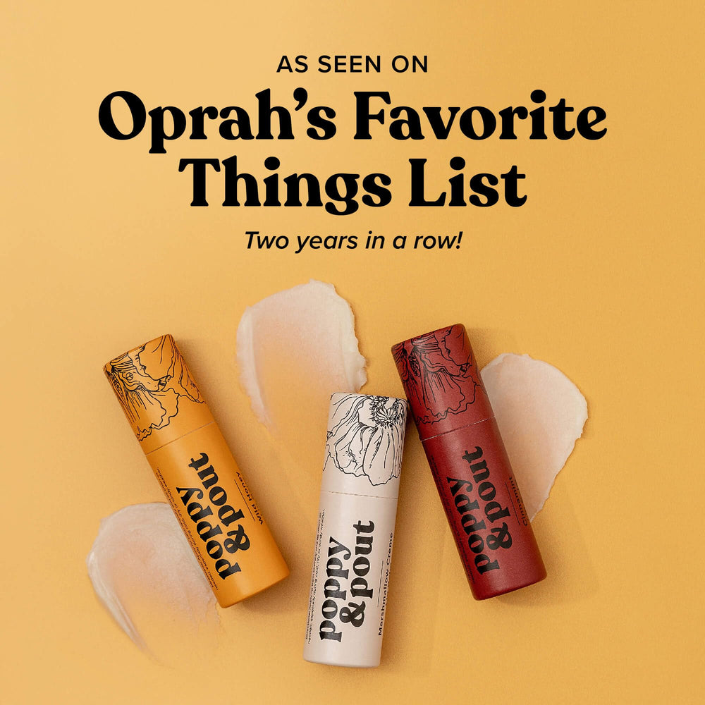 Poppy & Pout ingredient close-up with beeswax, vitamin E, and coconut oil.