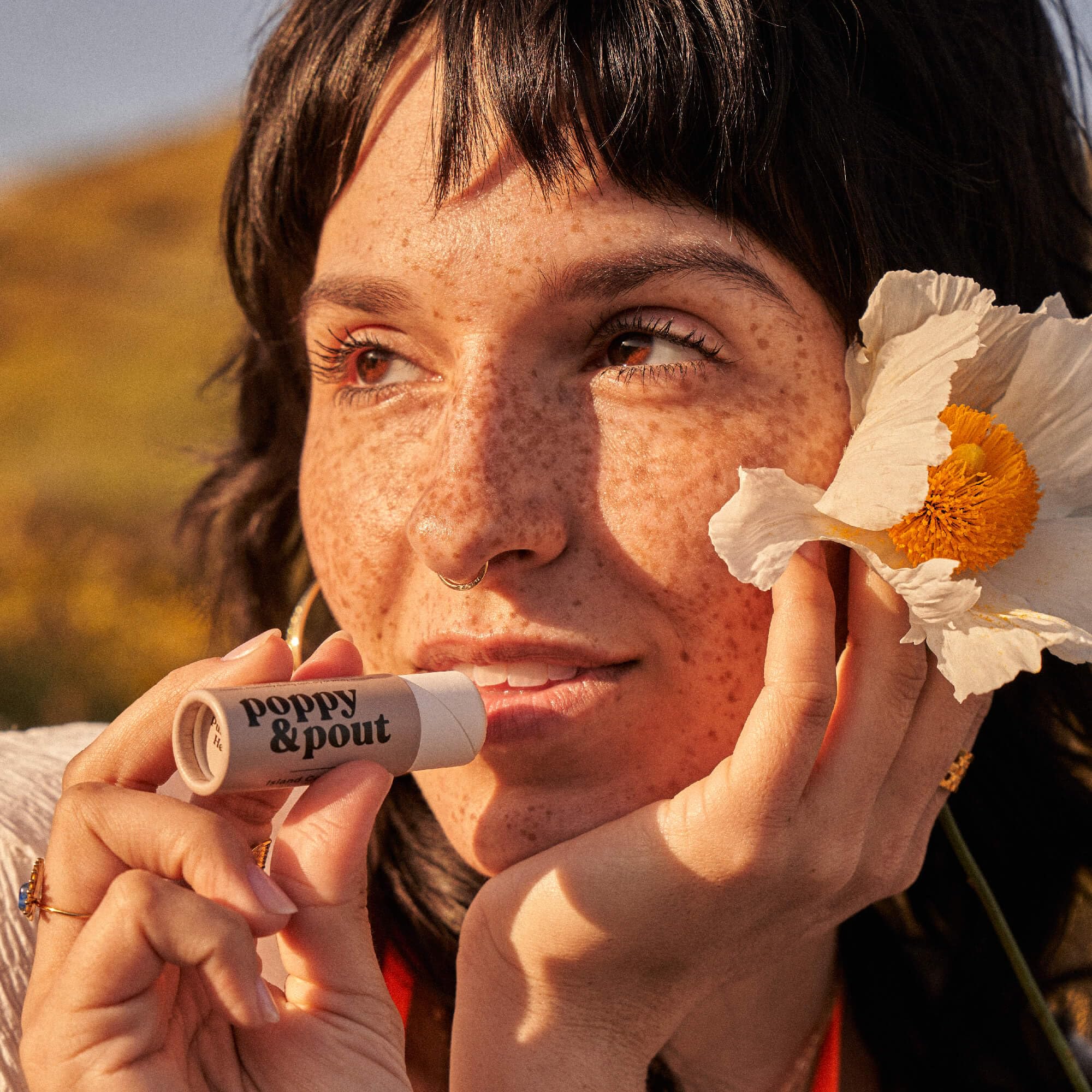 Close-up of Island Coconut lip balm texture showing smooth, nourishing formula.