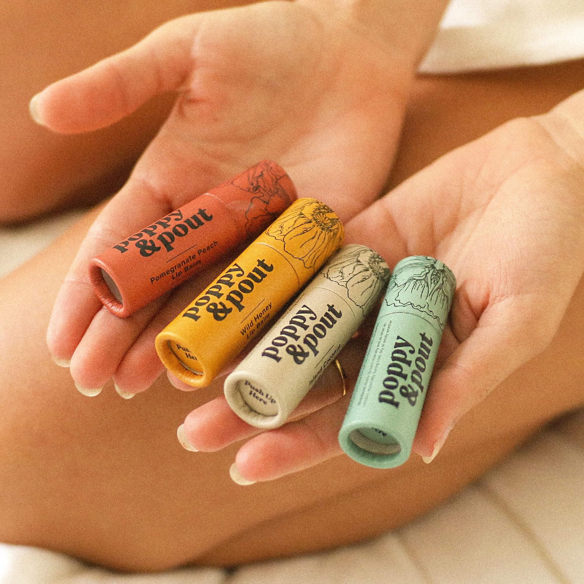 Recyclable cardboard tube from Poppy & Pout packaging for eco-conscious shoppers.