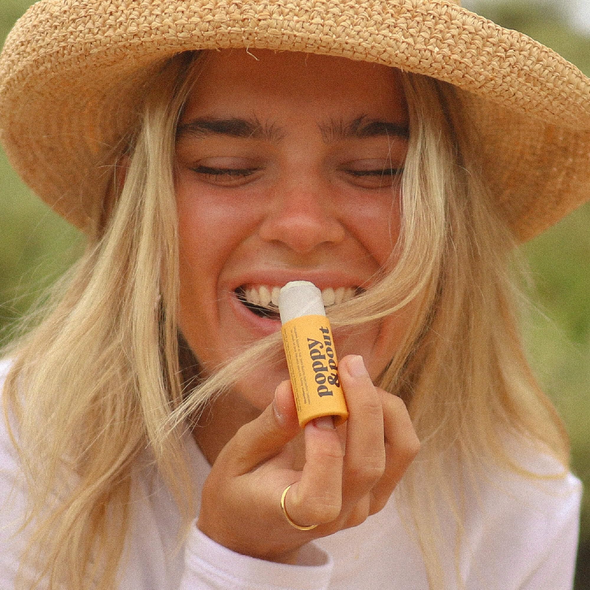 Ingredients list emphasizes organic coconut oil and USA-sourced beeswax for moisturizing lips.