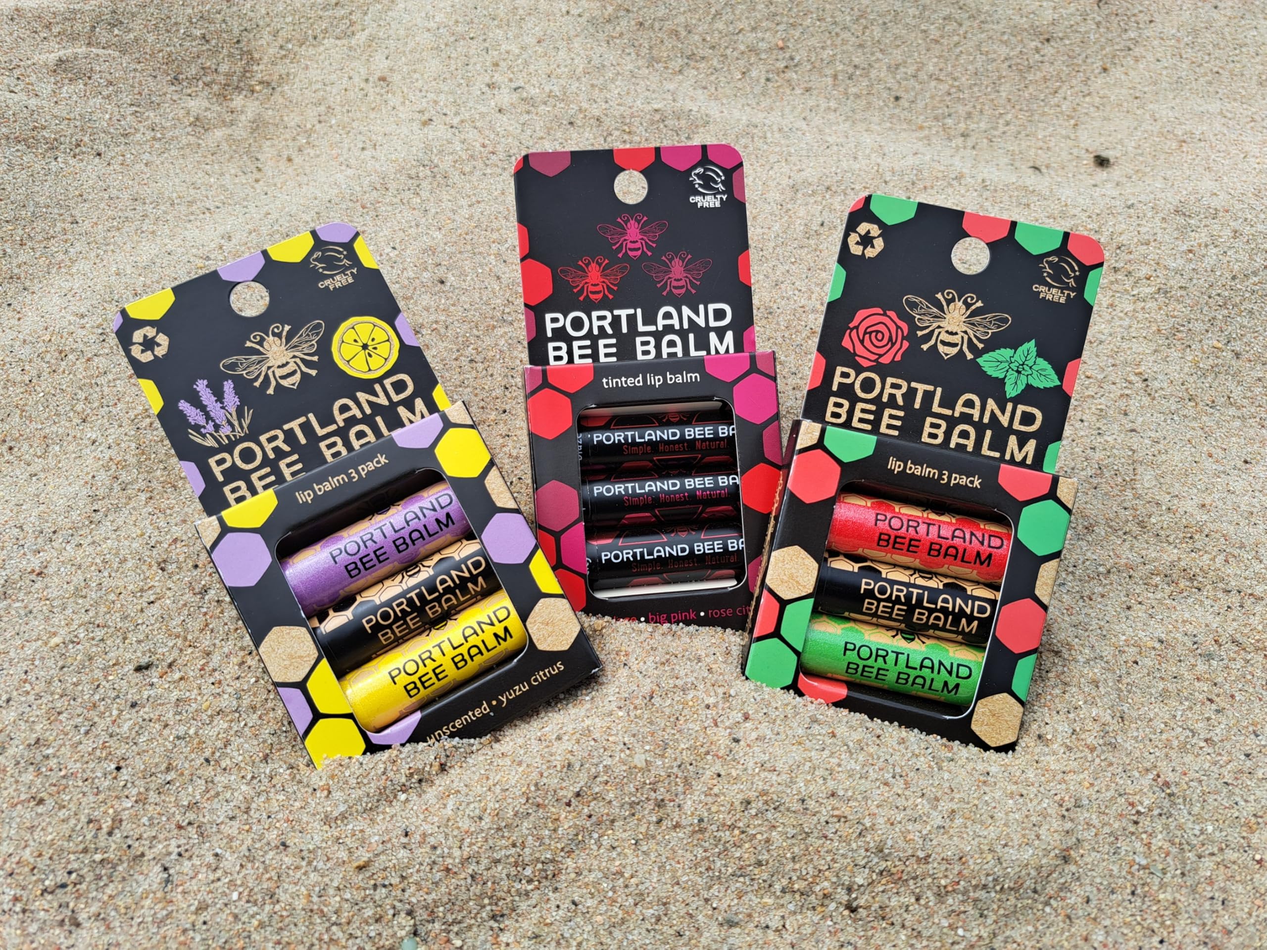 Portland Bee Balm tube in hand for portable lip care.