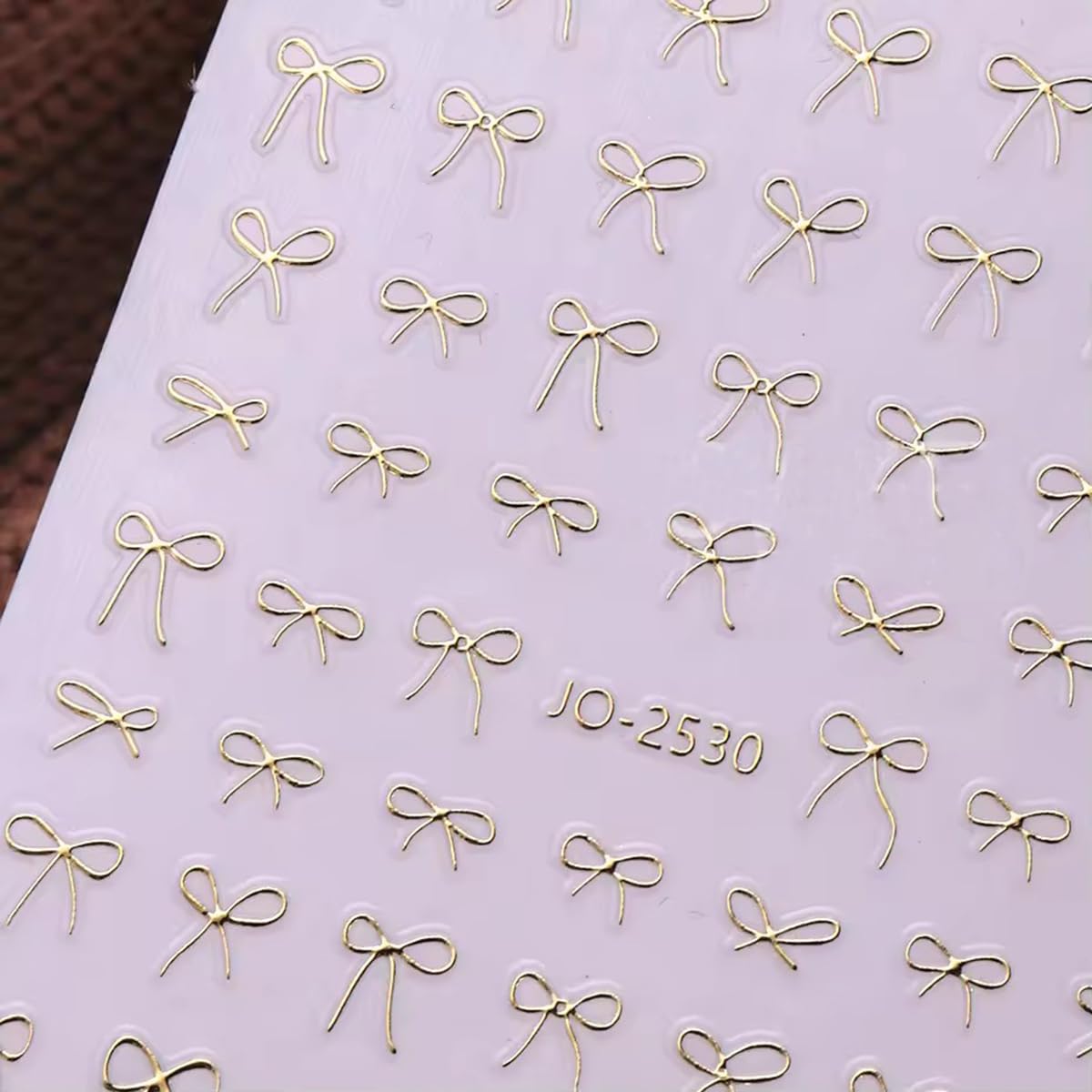 Powpop butterfly decals add delicate detail to natural or gel nails.