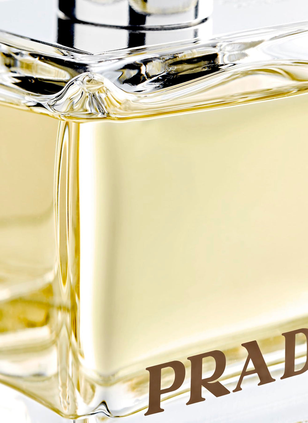 Prada Amber EdP elegant packaging with textured glass close-up for premium appeal.