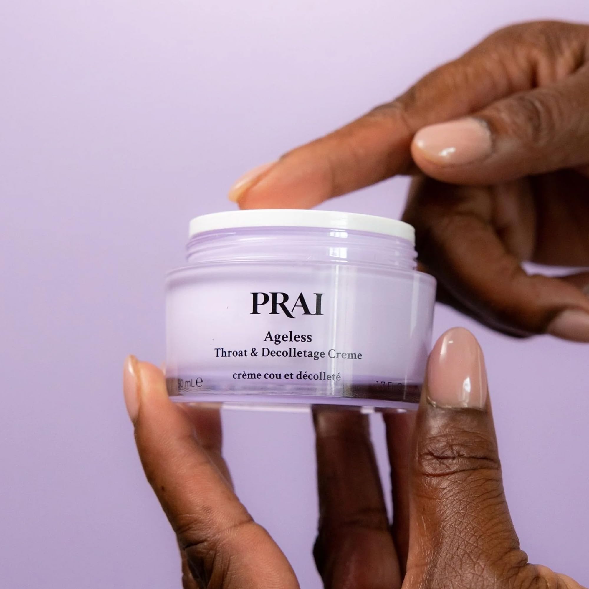 PRAI neck cream on décolletage creating a radiant, dewy glow.