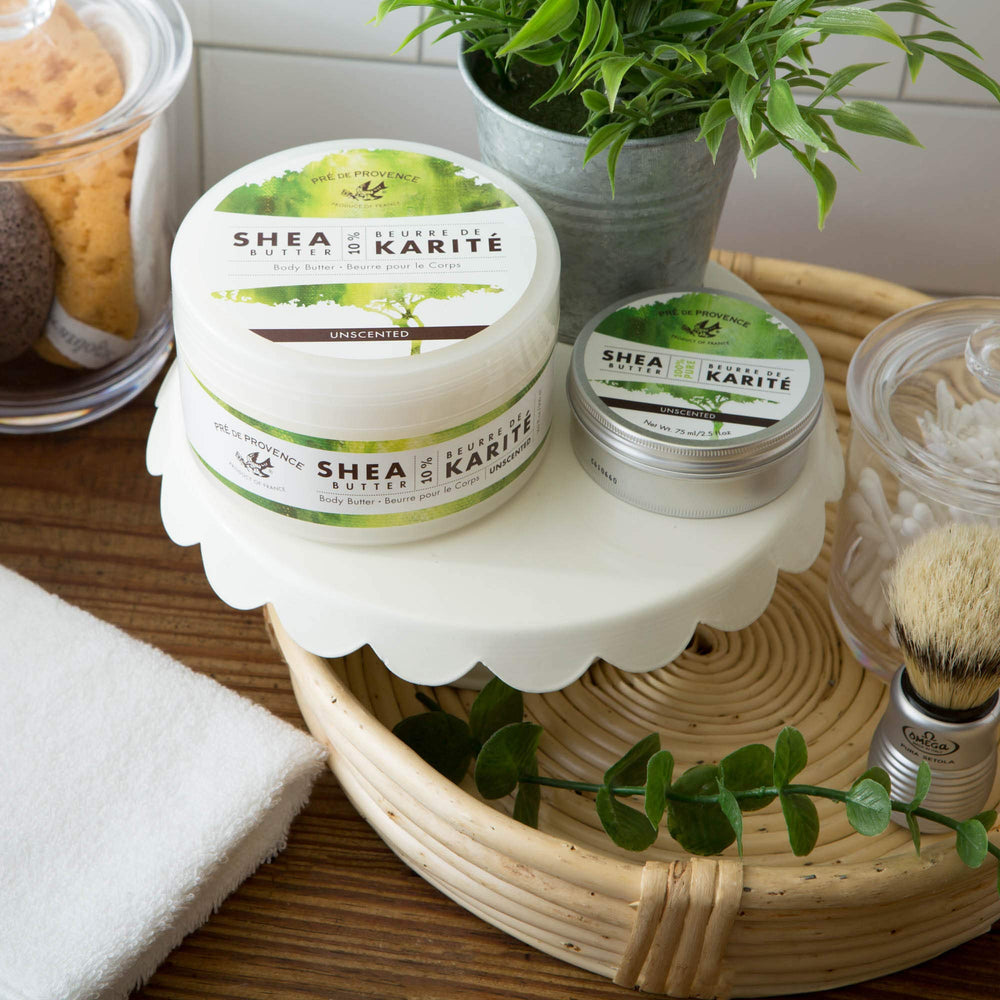 Pre de Provence Unscented body butter bottle on surface for gentle moisturization.