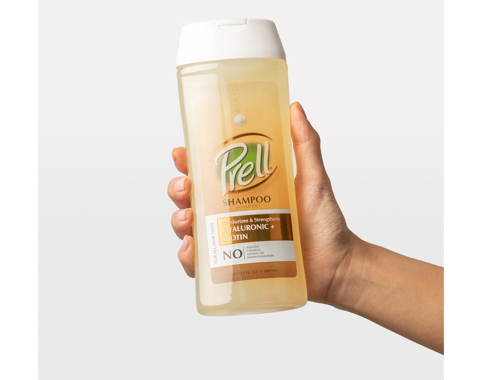 Conditioner being dispensed to reveal creamy formula