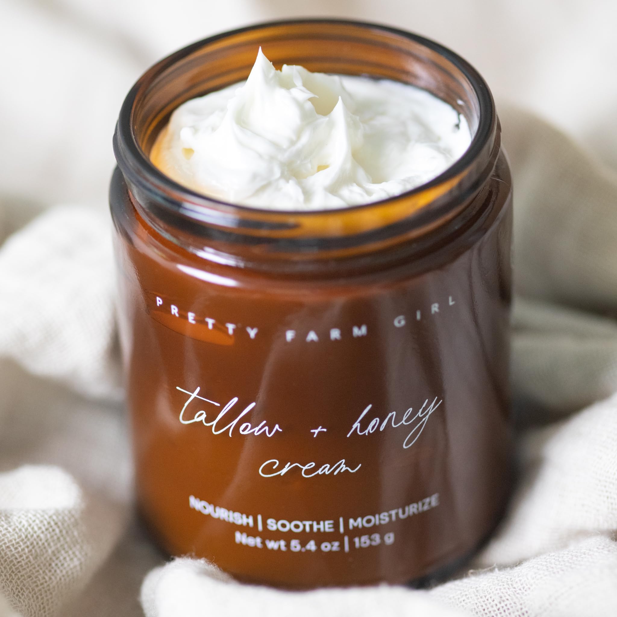 Pretty Farm Girl Tallow + Honey Body Butter cream swatch demonstrates smooth, lightly whipped texture