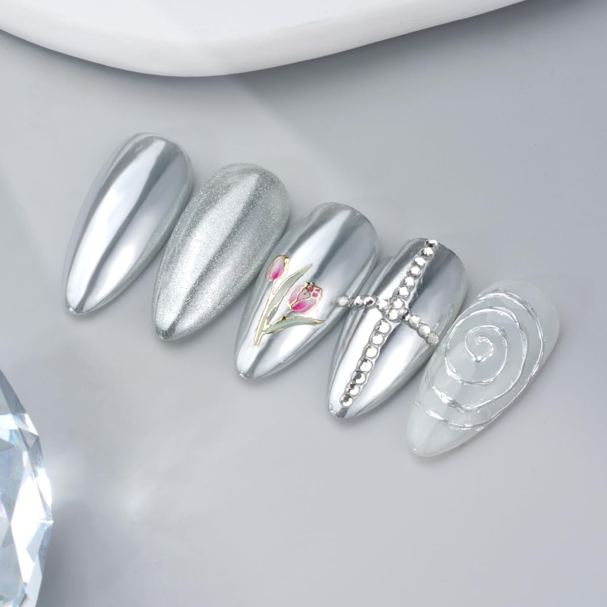 PrettyDiva silver mirror finish nails showcase a bold reflective chrome effect.
