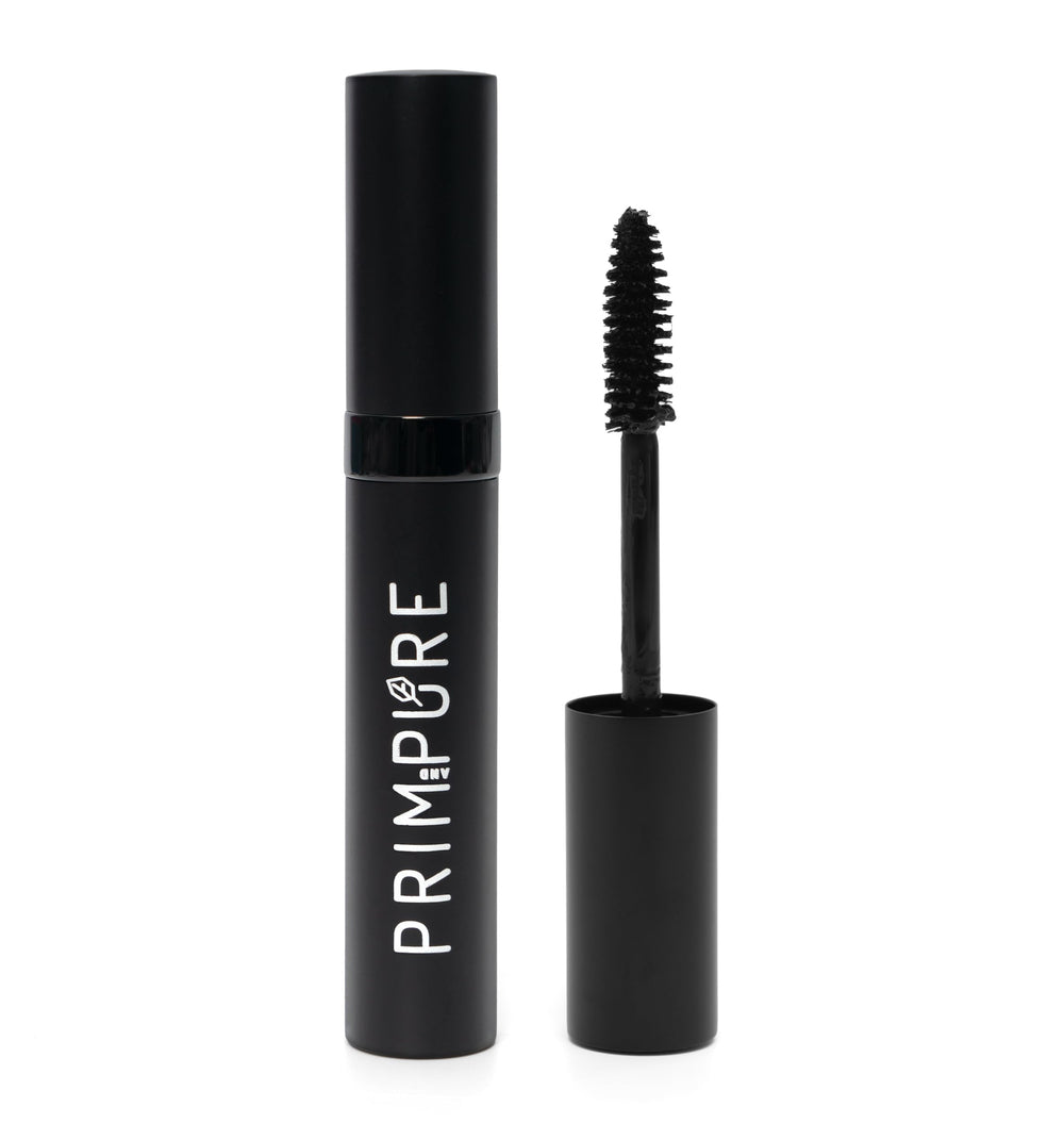 Prim and Pure mascara wand demonstrates precise application for defined lashes.