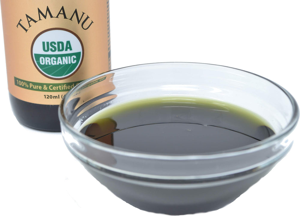 Gently massaging PRIME NATURAL Tamanu oil into the scalp for nourishment.