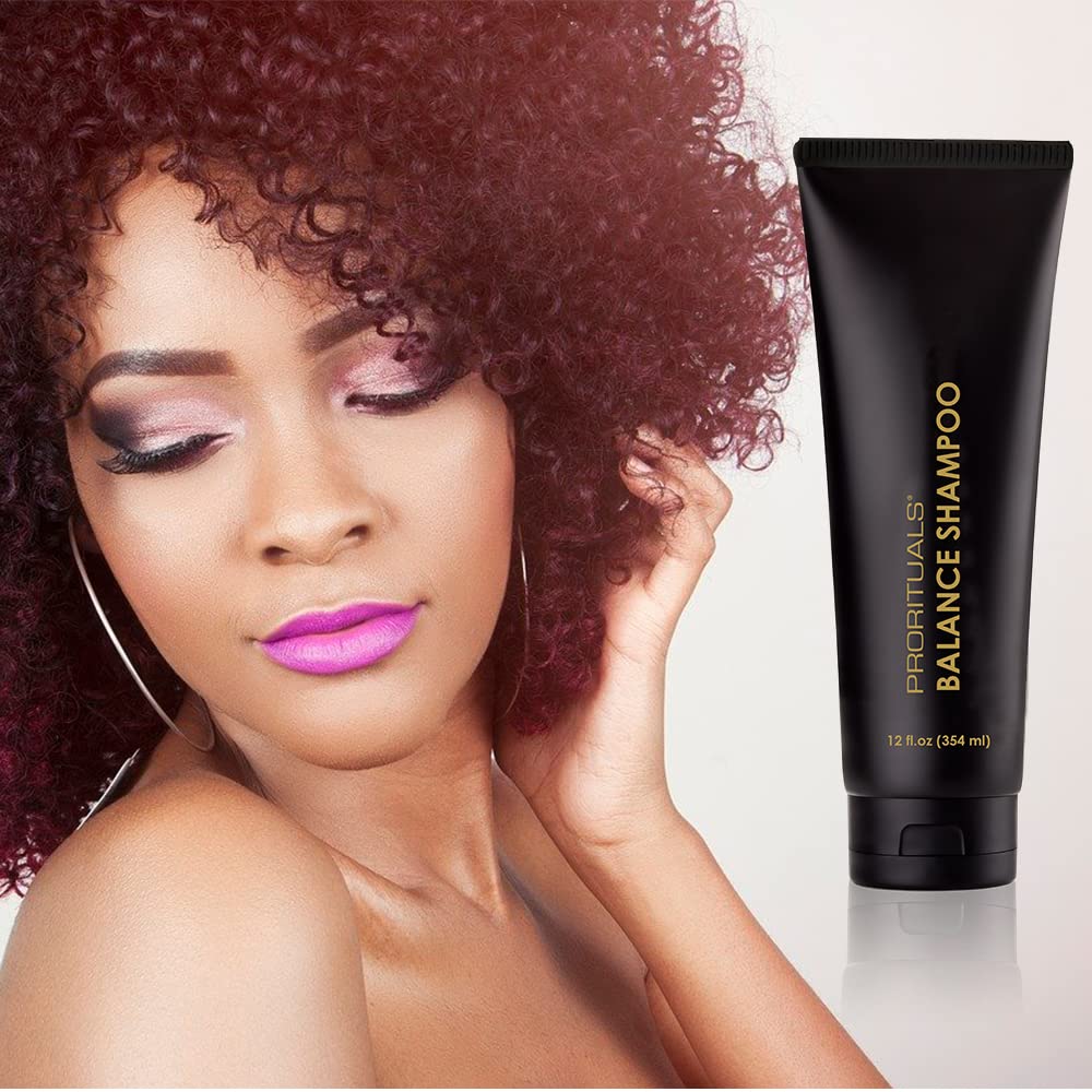 Hands applying Prorituals Balance Shampoo to damp hair for scalp nourishment