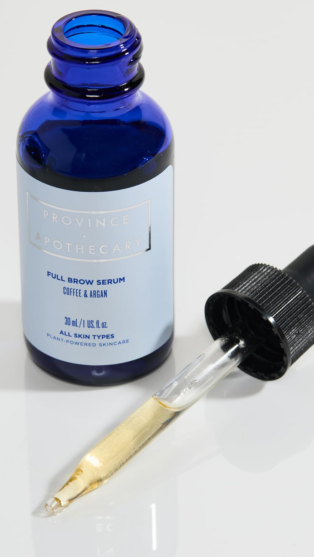 Person applying Province Apothecary brow serum to damp brows for absorption.