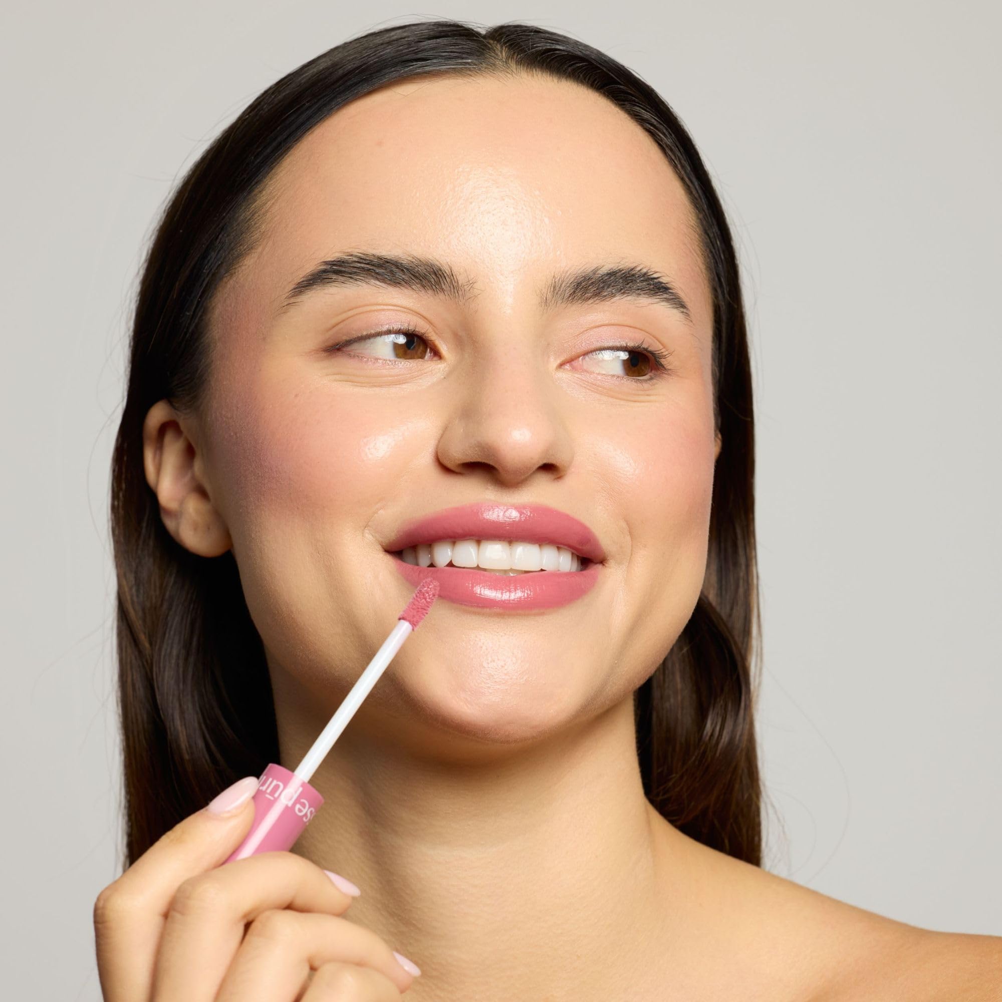 Pūrlisse Dew lip gloss packaging highlights a clean formula.