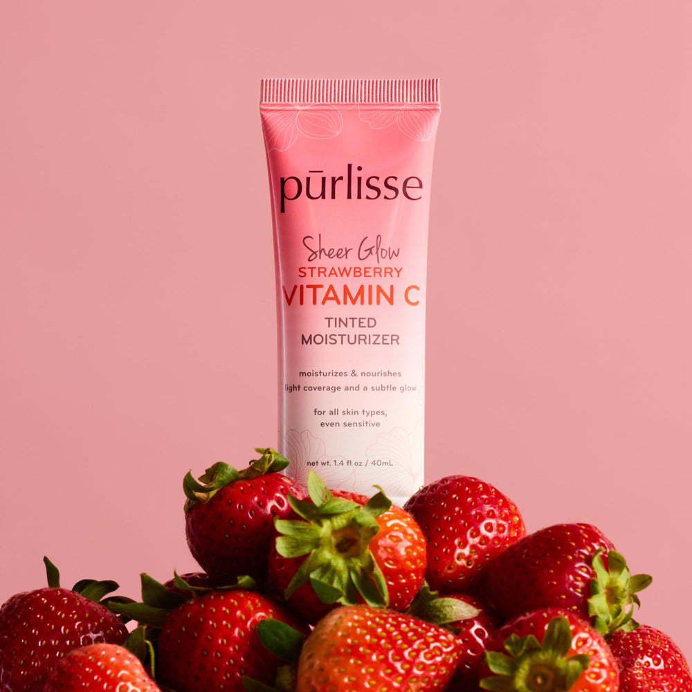 pürlisse Sheer Glow packaging sits on a dresser suggesting a clean beauty routine.