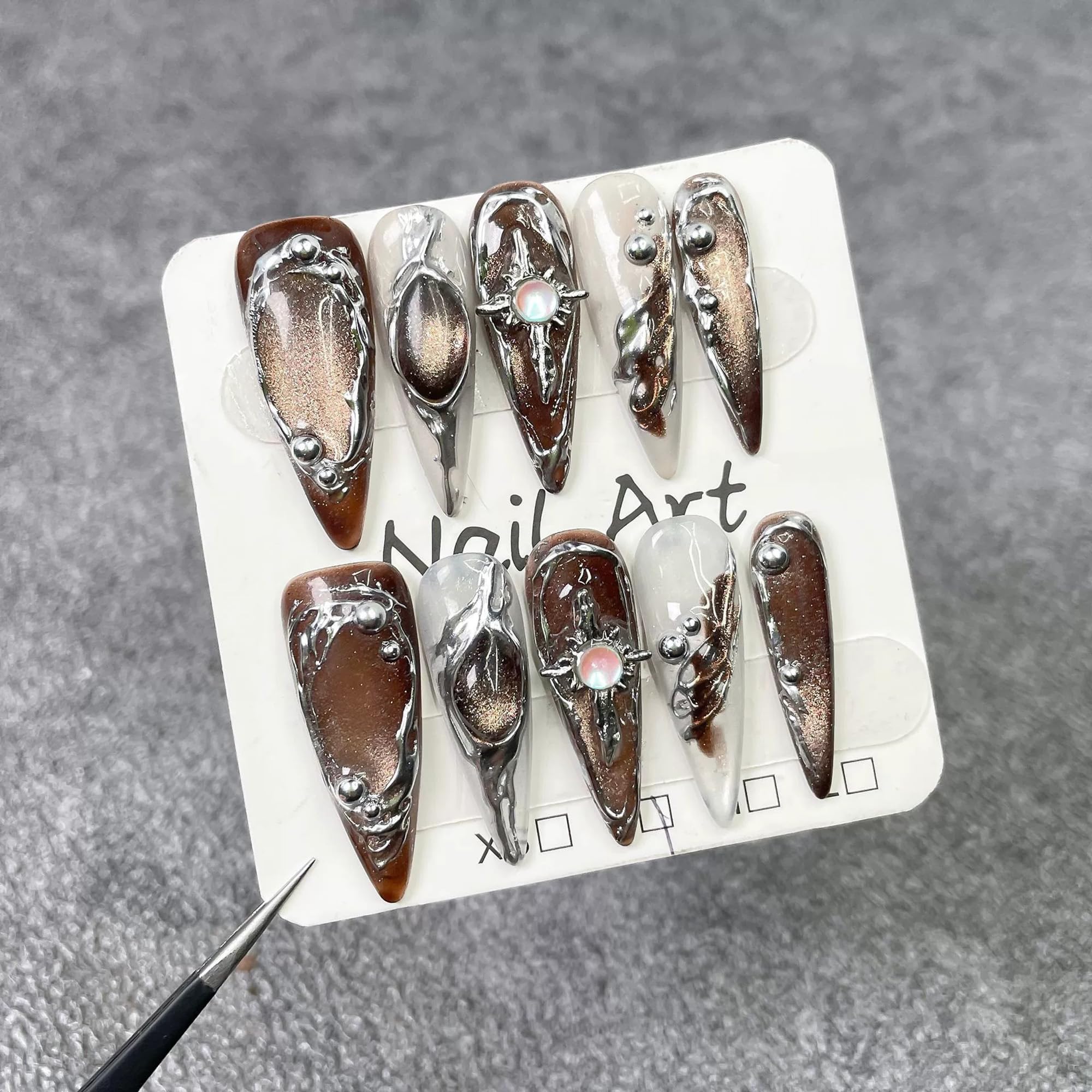 Qicaijia embossed swirl design nails add tactile luxury and shimmer