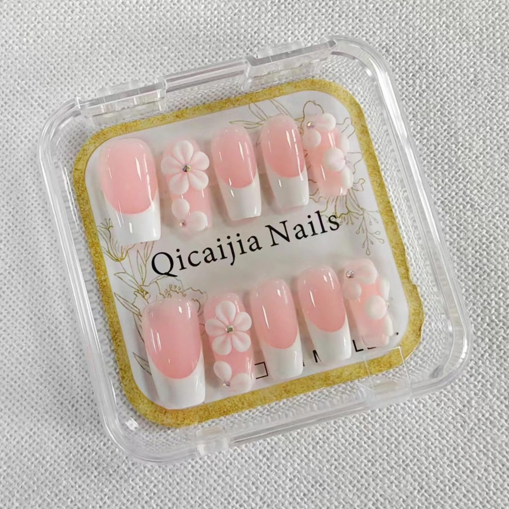 Qicaijia luxury press-on nails with flower embossing for an elegant look.